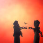 silhouette human hands raising and broken chains at night background