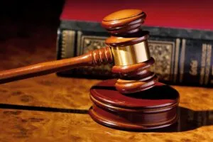 the judge hammer a judge in court. located on a desk.