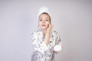 motivated girl makes her cheeks creamy