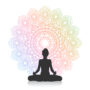 silhouette of female in yoga pose against mandala design