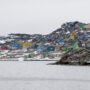 aerial shot of colorful houses in aasiaat city, greenland