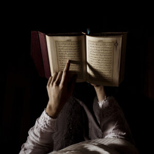 silhouette woman reading quran
