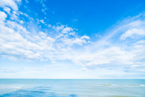 white cloud on blue sky and sea