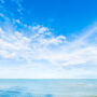 white cloud on blue sky and sea