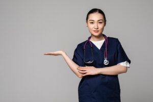 medical doctor woman presenting and showing copy space for product or text.