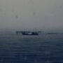 abandoned boat rainy dark sea