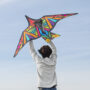young adult having fun with kite