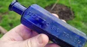 dog 'solves victorian murder' after digging up poison bottle in the garden