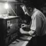 black white vintage portrait man doing housework household chores