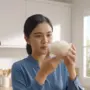 woman observing rice in kitchen 2k 202609051158
