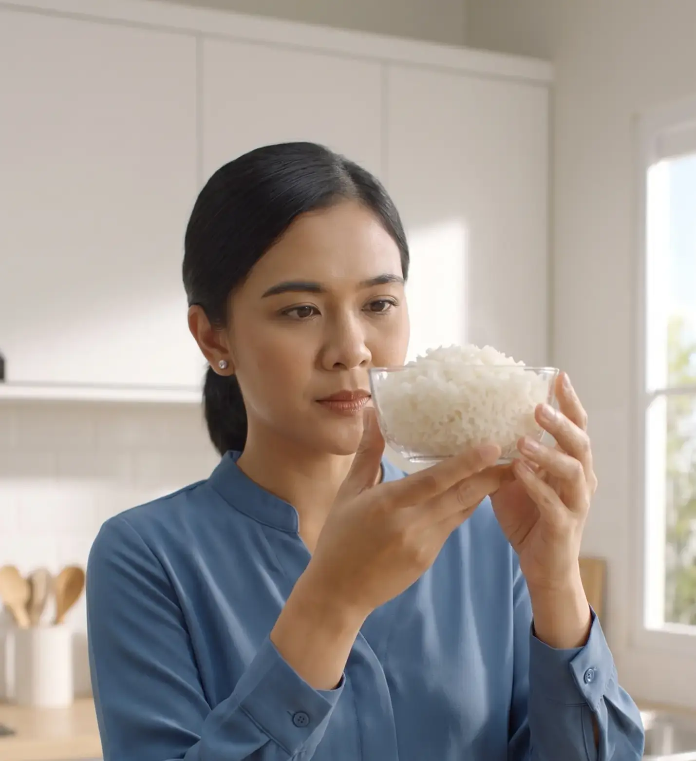 woman observing rice in kitchen 2k 202609051158
